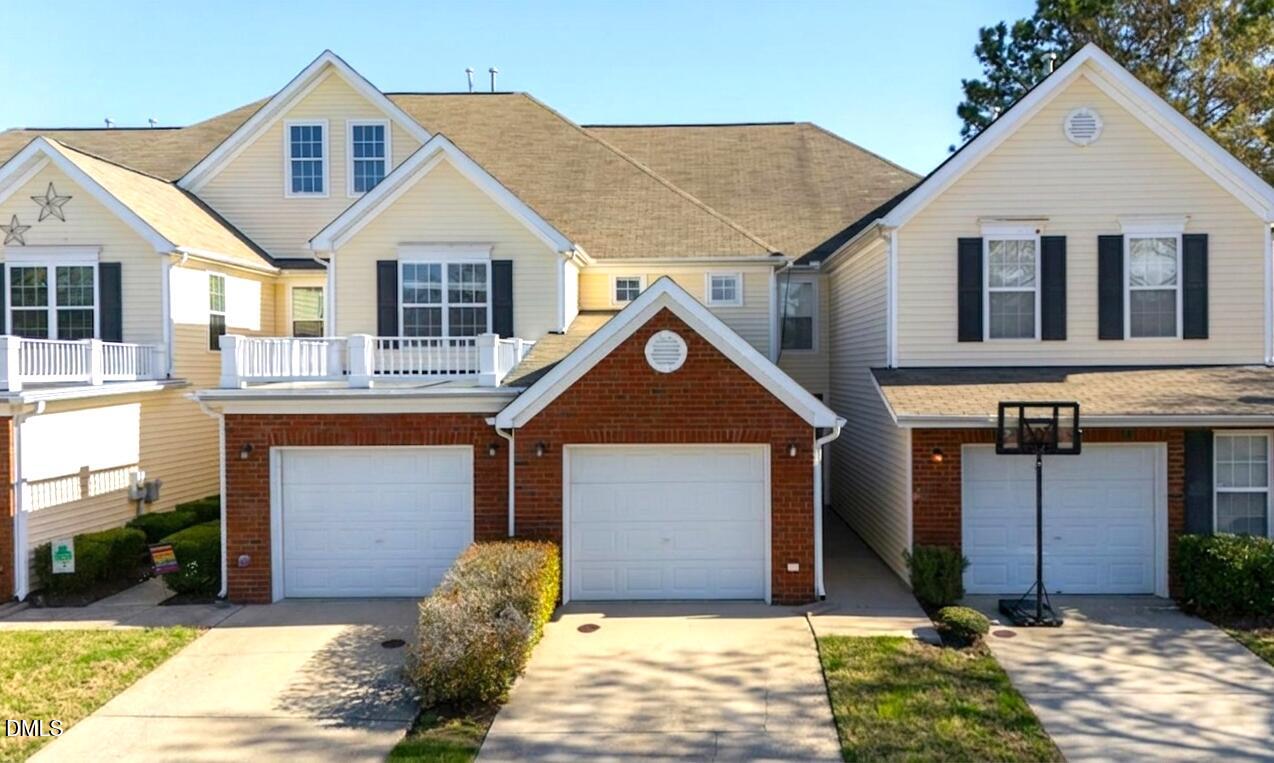 2621 Hamlet Green Drive Raleigh, NC 27614 - Photo 1 of 20 a front view of a house with a yard and garage