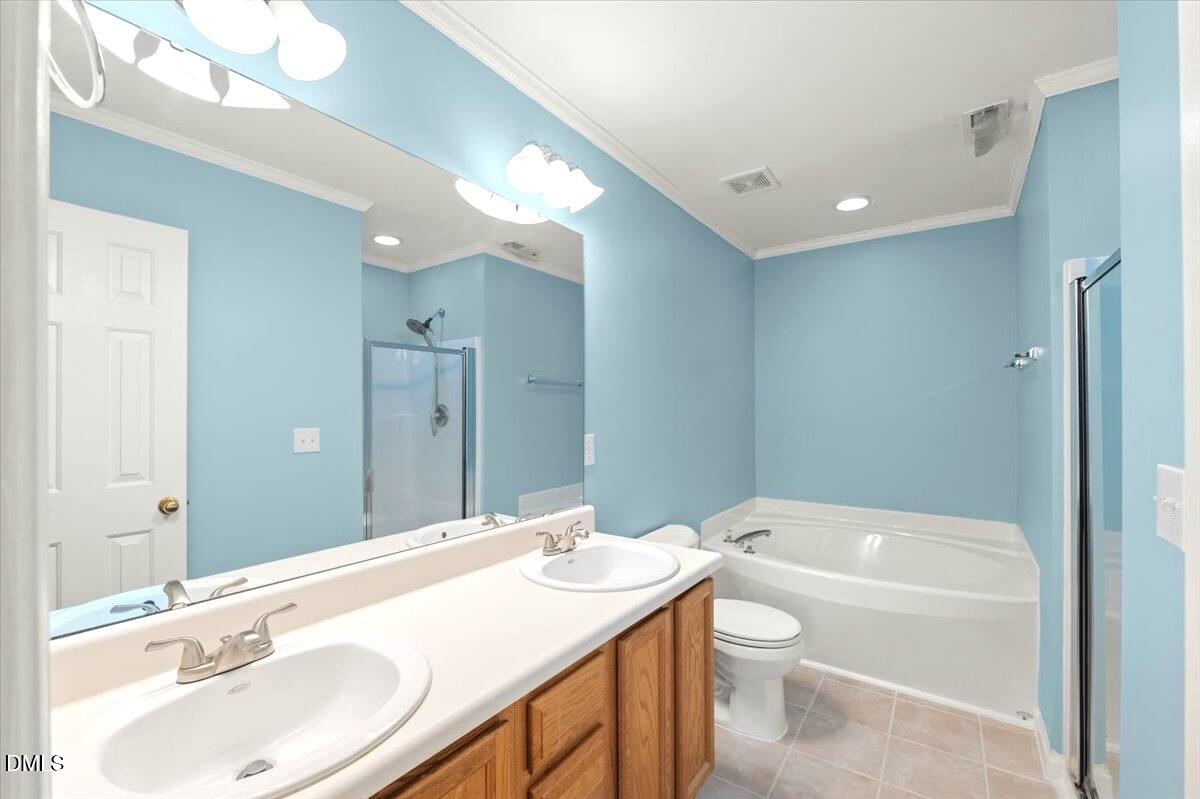 2621 Hamlet Green Drive Raleigh, NC 27614 - Photo 15 of 20 a bathroom with a granite countertop sink a toilet a large mirror and shower