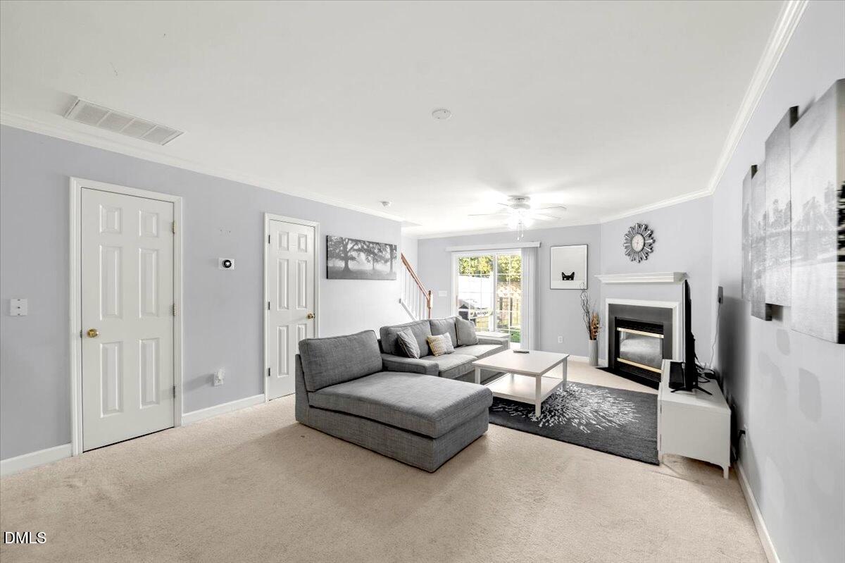 2621 Hamlet Green Drive Raleigh, NC 27614 - Photo 5 of 20 a living room with furniture and a fireplace