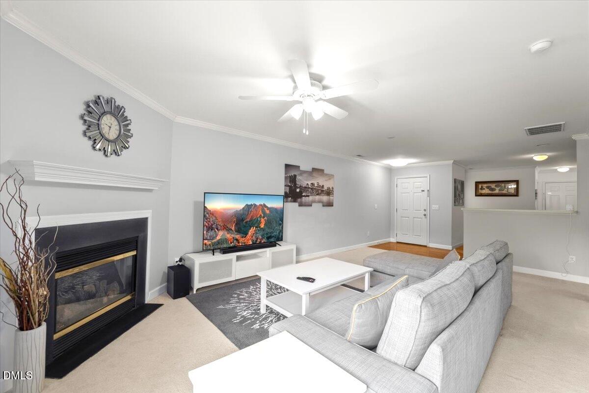 2621 Hamlet Green Drive Raleigh, NC 27614 - Photo 8 of 20 a living room with furniture and a fireplace