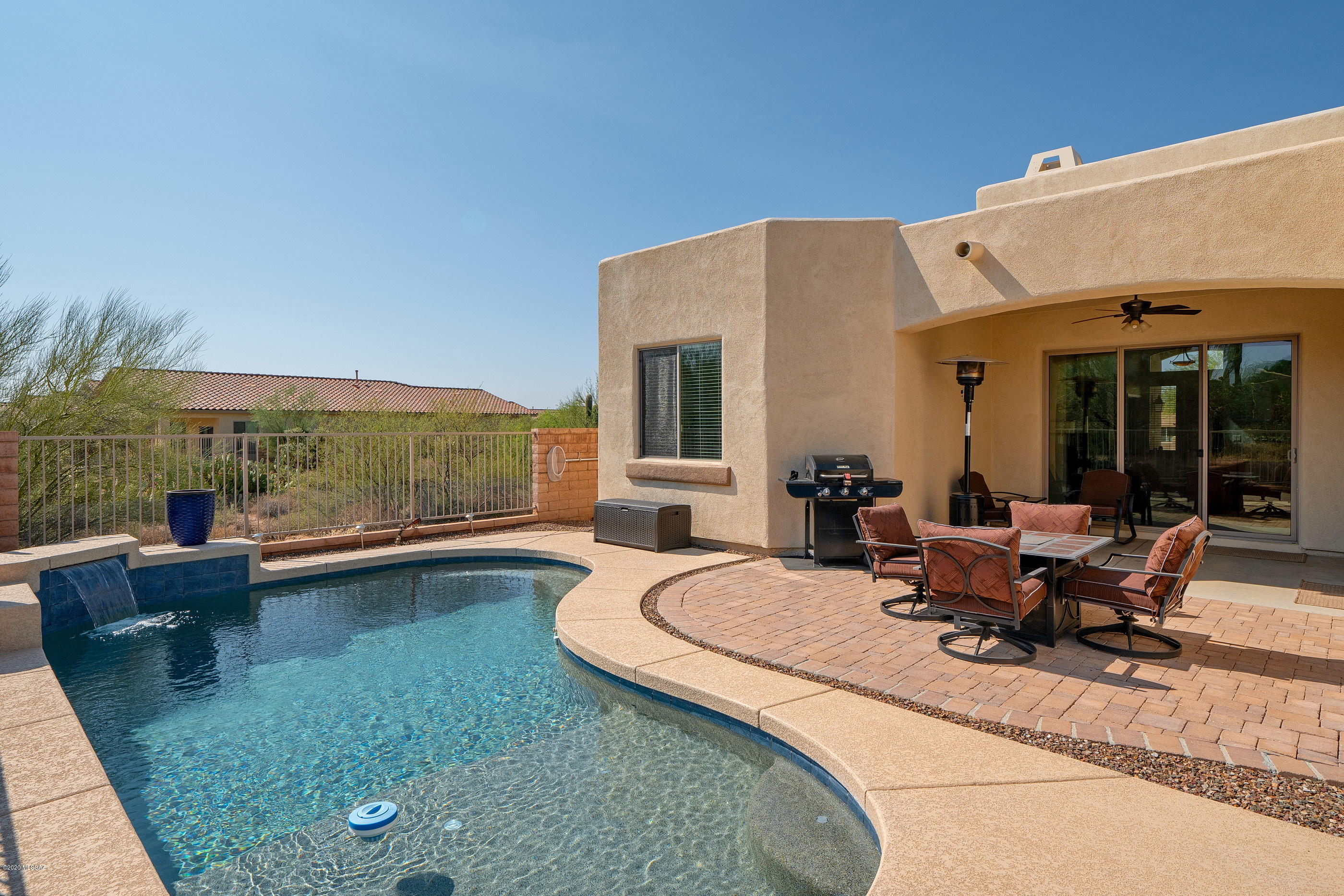4440 West Crystal Ranch Place Marana, AZ 85658 - Photo 7 of 28 a view of a house with pool and chairs