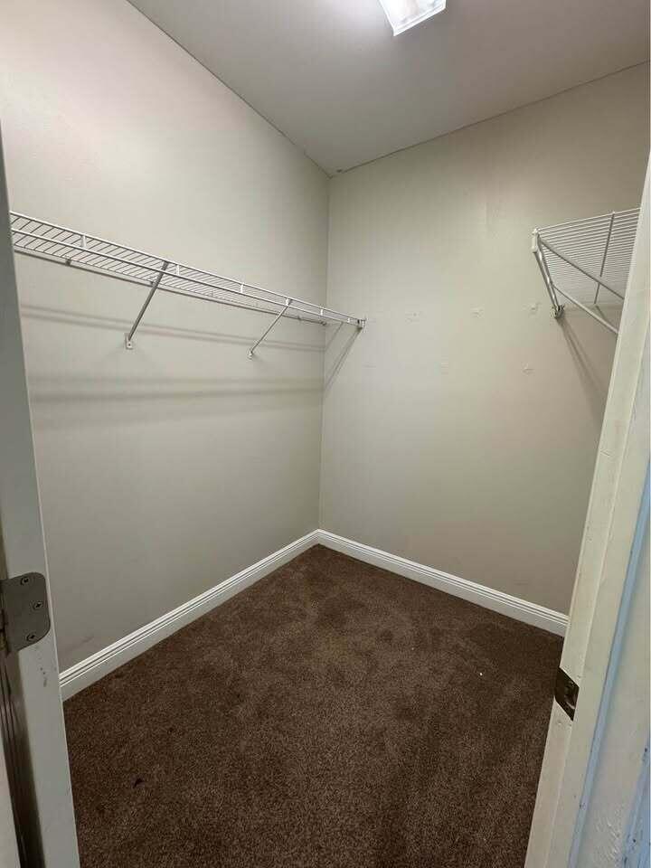 371 Symphony Way Freeport, FL 32439 - Photo 13 of 26 a view of a room with racks on the wall