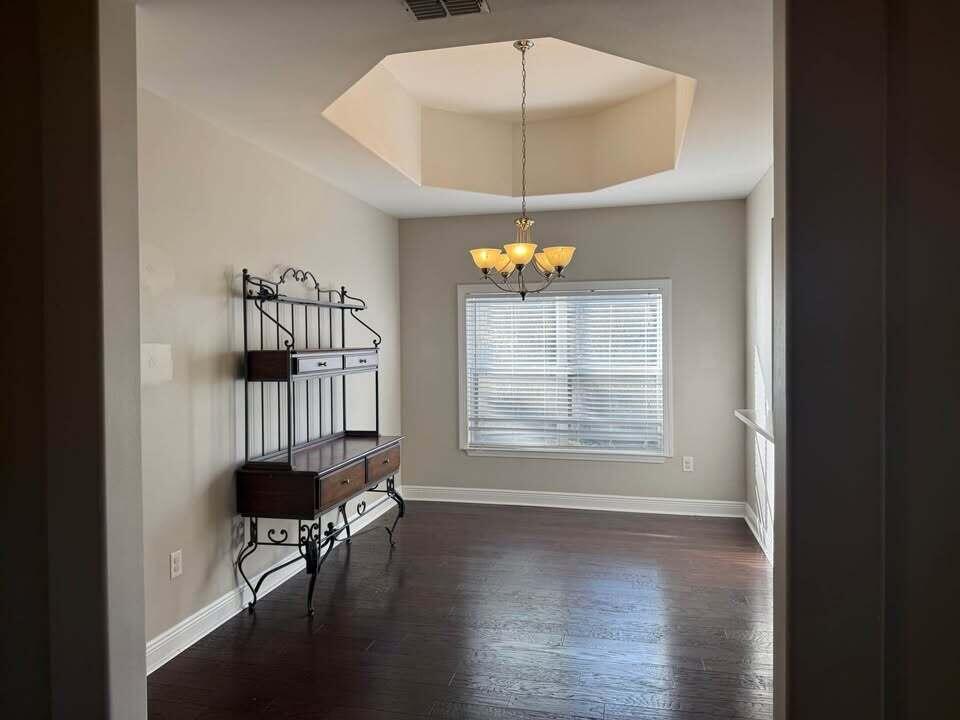 371 Symphony Way Freeport, FL 32439 - Photo 19 of 26 a view of an empty room with a window and wooden floor