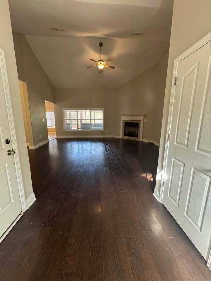 371 Symphony Way Freeport, FL 32439 - Photo 23 of 26 wooden floor in an empty room with a window