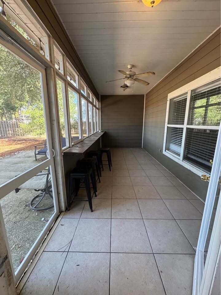 371 Symphony Way Freeport, FL 32439 - Photo 7 of 26 a view of a furniture in an empty room with a window