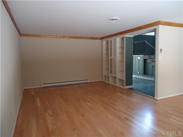 1533 Shadowood Lane Raleigh, NC 27612 - Photo 3 of 21 BUILT-IN VINTAGE SHELVING AND NEW ENGINEERED HARDWOOD RED OAK FLOORS. SMOOTH CEILINGS WERE PART OF REMODELING.