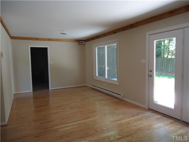 1533 Shadowood Lane Raleigh, NC 27612 - Photo 4 of 21 L OF LIVING DINING ROOM ... WE ARE LOOKING AT CHANDELIERS RIGHT NOW AND WILL REPLACE. FORMER WAS DAMAGED DURING REMODELING .:(
