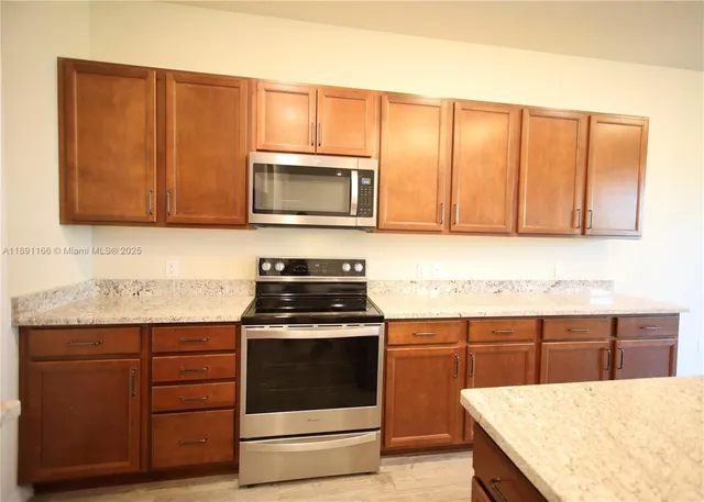 a bathroom with a double vanity sink and a window