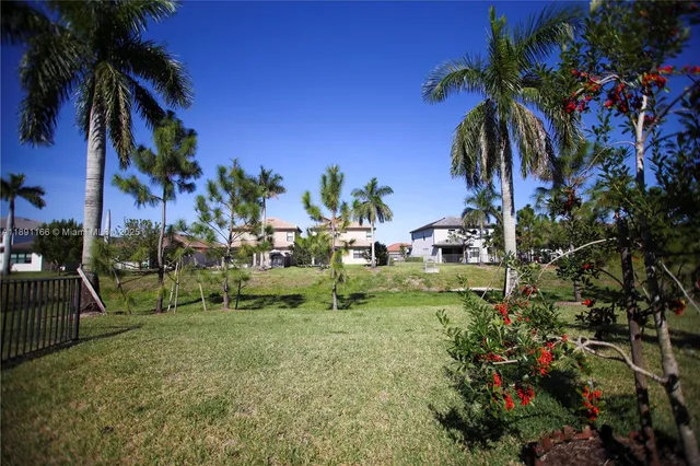 a view of a livingroom with a ceiling fan and window