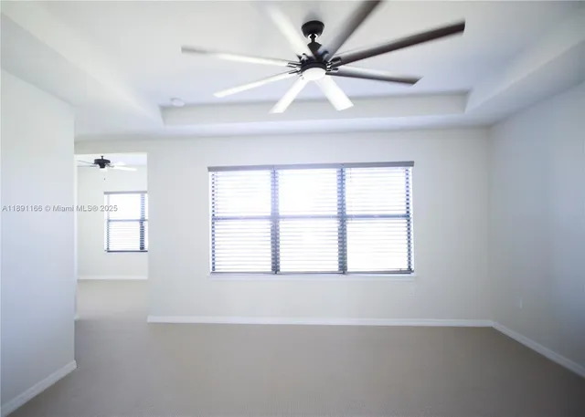a bathroom with a granite countertop sink a mirror a vanity and a shower