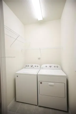 a kitchen with stainless steel appliances granite countertop a stove and refrigerator