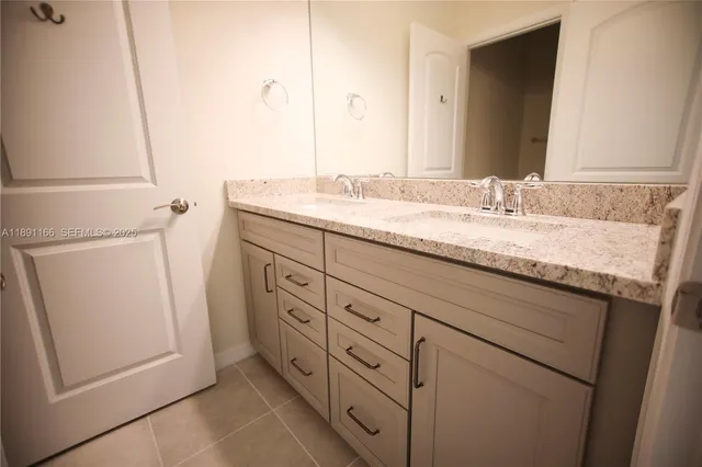 a living room with furniture a rug and a large window