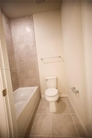 a living room with furniture a rug and a large window