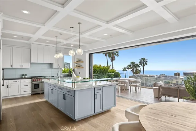 a kitchen with stainless steel appliances granite countertop a stove and cabinets