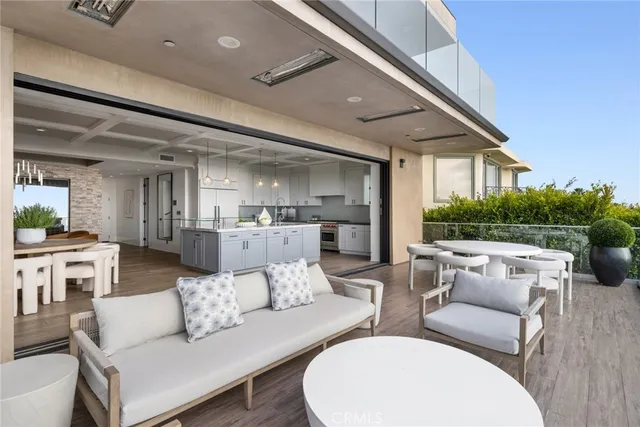 a kitchen with stainless steel appliances granite countertop a sink a stove and a wooden floors