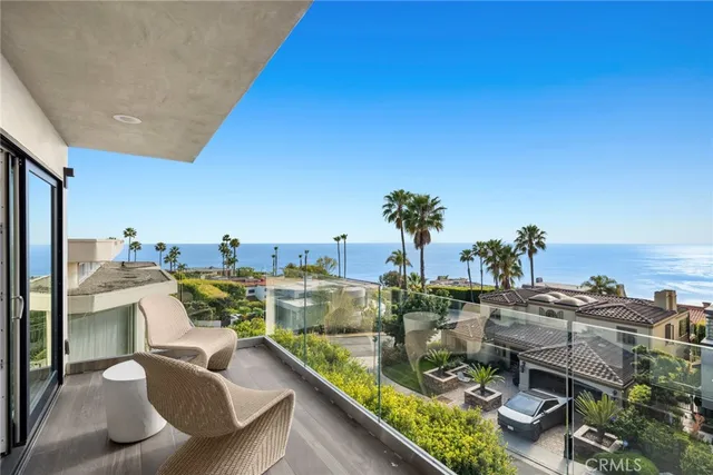 a view of living room with furniture and a floor to ceiling window