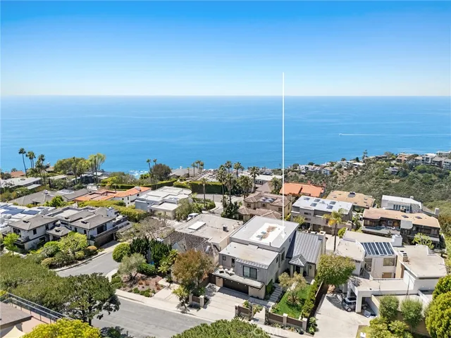 an aerial view of residential building with parking space