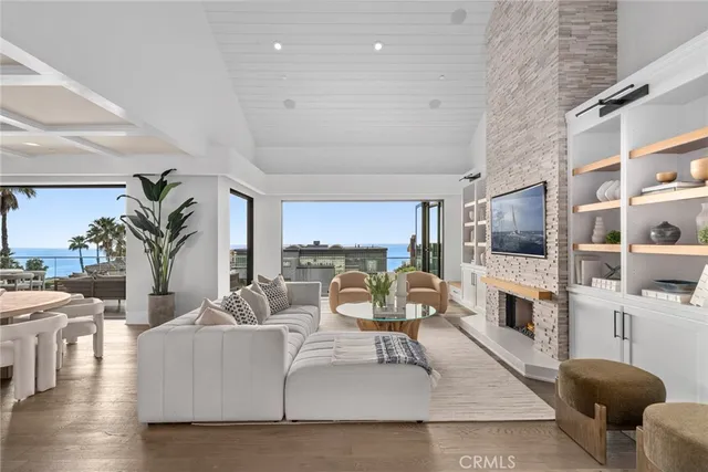 a living room with fireplace furniture and a flat screen tv