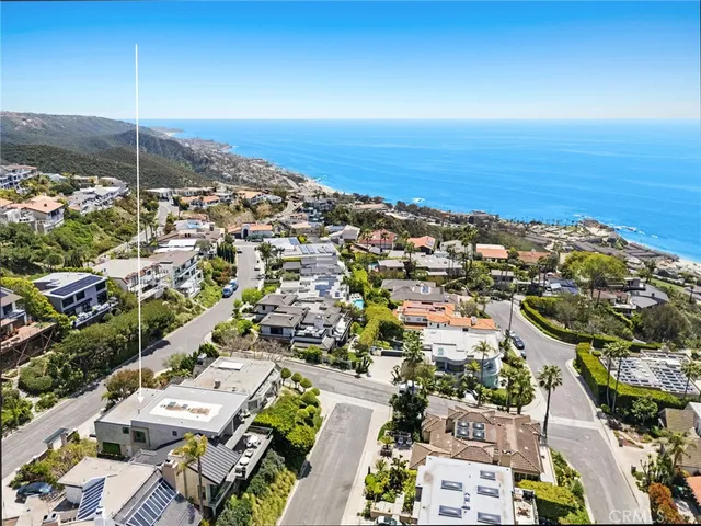 an aerial view of residential building and ocean