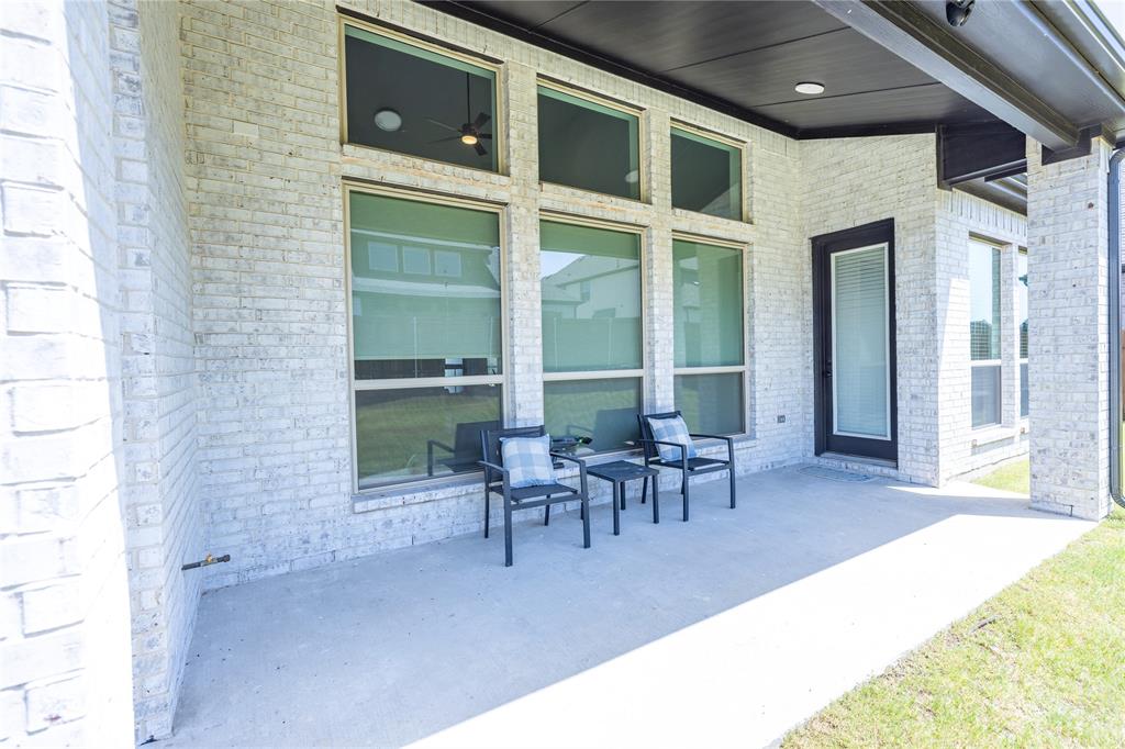 12135 Cotton Field Road Frisco, TX 75035 - Photo 35 of 38 Covered patio featuring a concrete surface and light-colored brick exterior