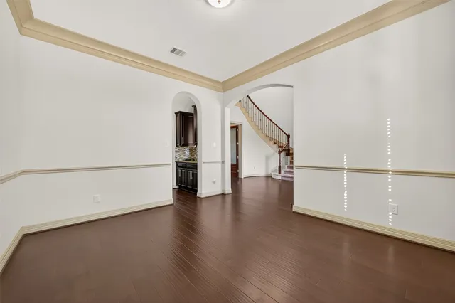 a spacious bathroom with a granite countertop sink and a mirror