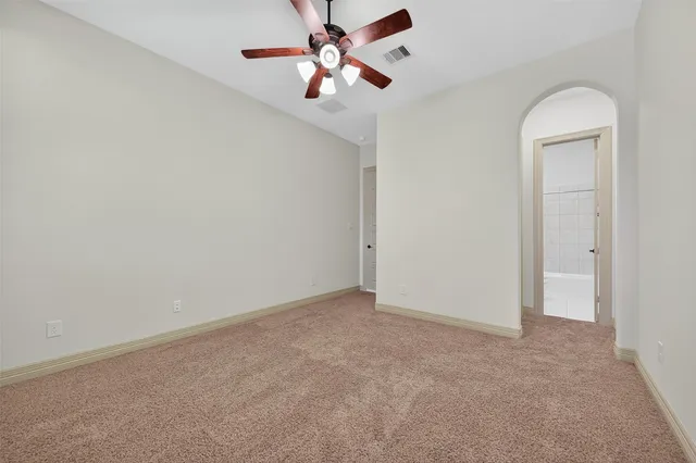 a living room with furniture and screen