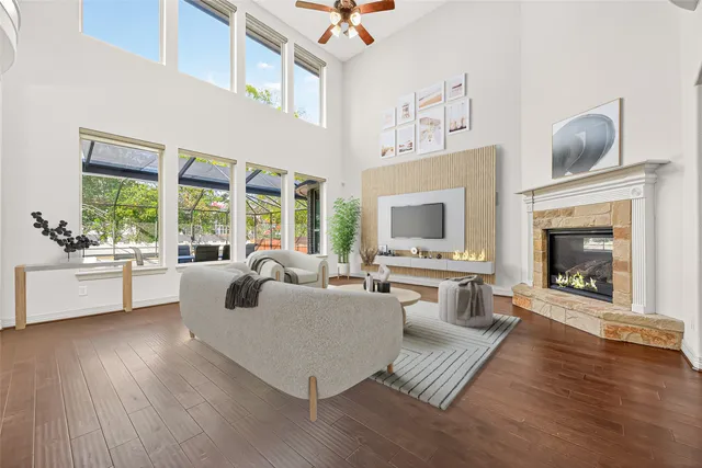 a view of a kitchen with kitchen island stainless steel appliances refrigerator stove top oven and cabinets
