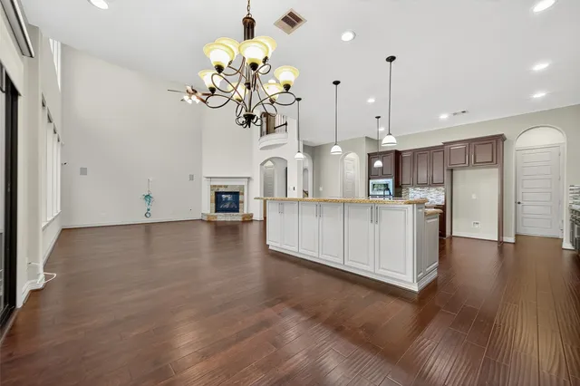 a kitchen with stainless steel appliances granite countertop wooden cabinets sink and stove