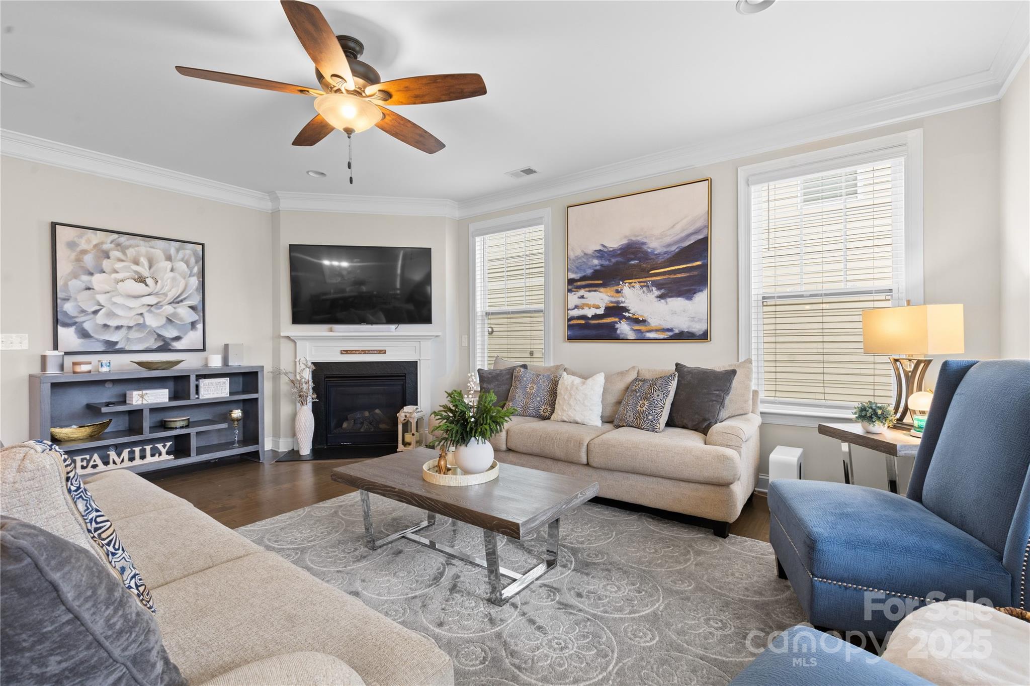 7035 Bareland Road Fort Mill, SC 29707 - Photo 16 of 47 a living room with furniture a fireplace and a flat screen tv