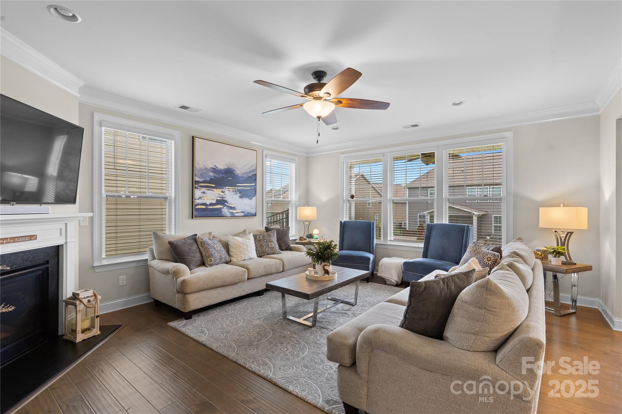 7035 Bareland Road Fort Mill, SC 29707 - Photo 17 of 47 a living room with fireplace furniture and a flat screen tv
