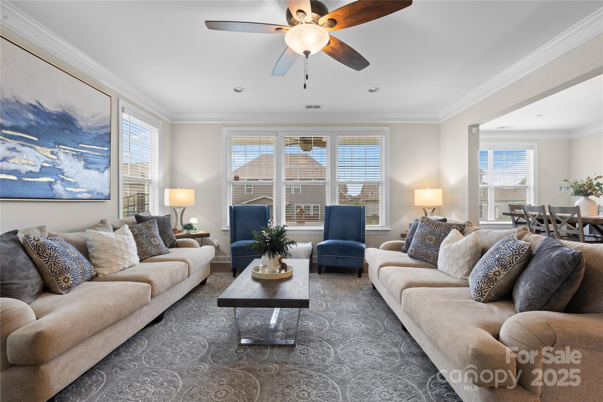 7035 Bareland Road Fort Mill, SC 29707 - Photo 18 of 47 a living room with furniture a fireplace and a chandelier