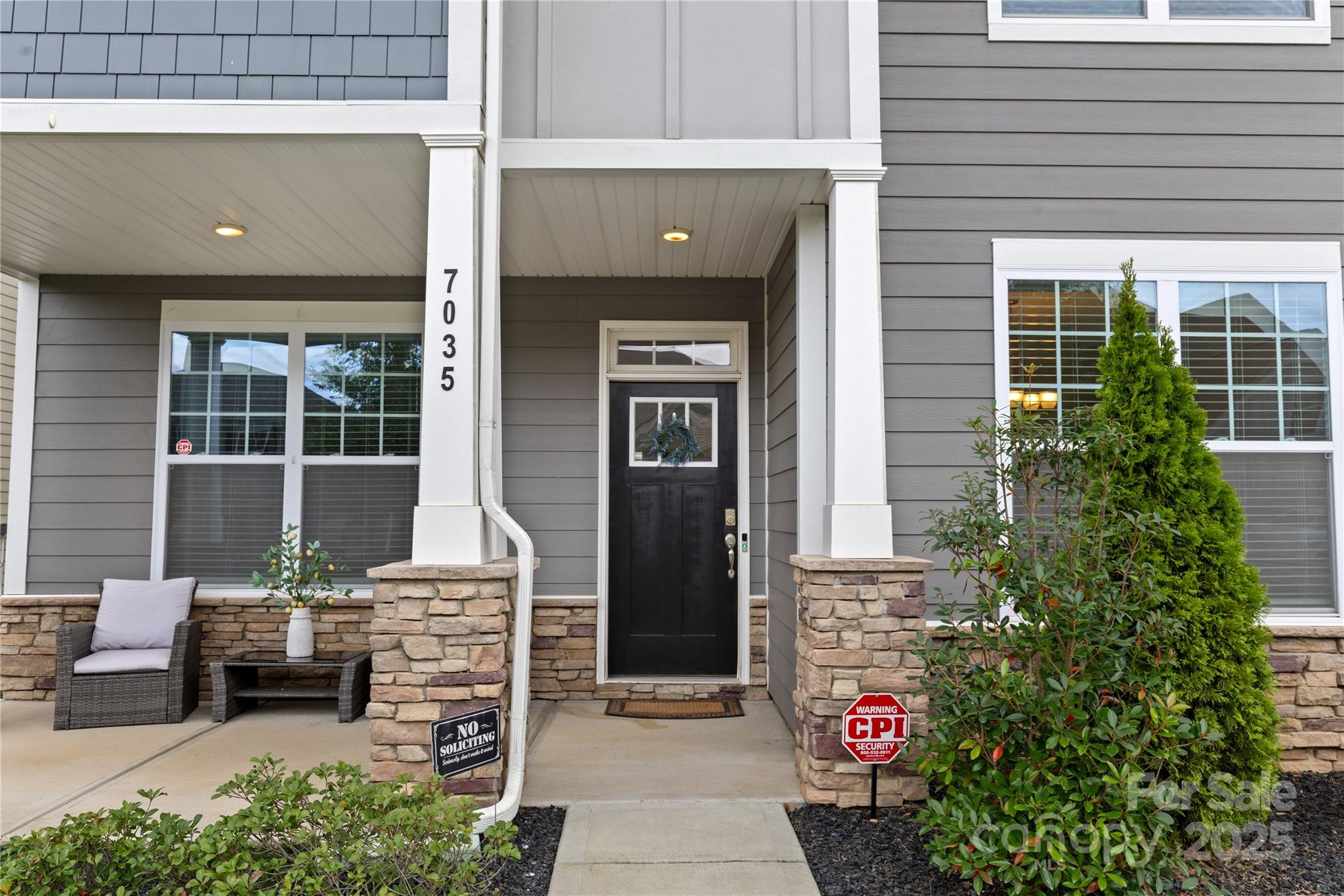 7035 Bareland Road Fort Mill, SC 29707 - Photo 2 of 47 a front view of a house with a potted plant