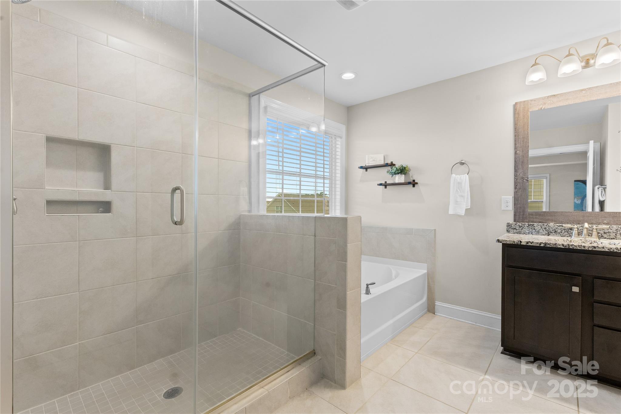 7035 Bareland Road Fort Mill, SC 29707 - Photo 26 of 47 a bathroom with a granite countertop sink a toilet and shower