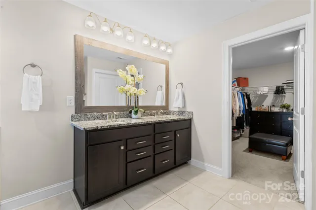 a bathroom with a sink double vanity and a mirror