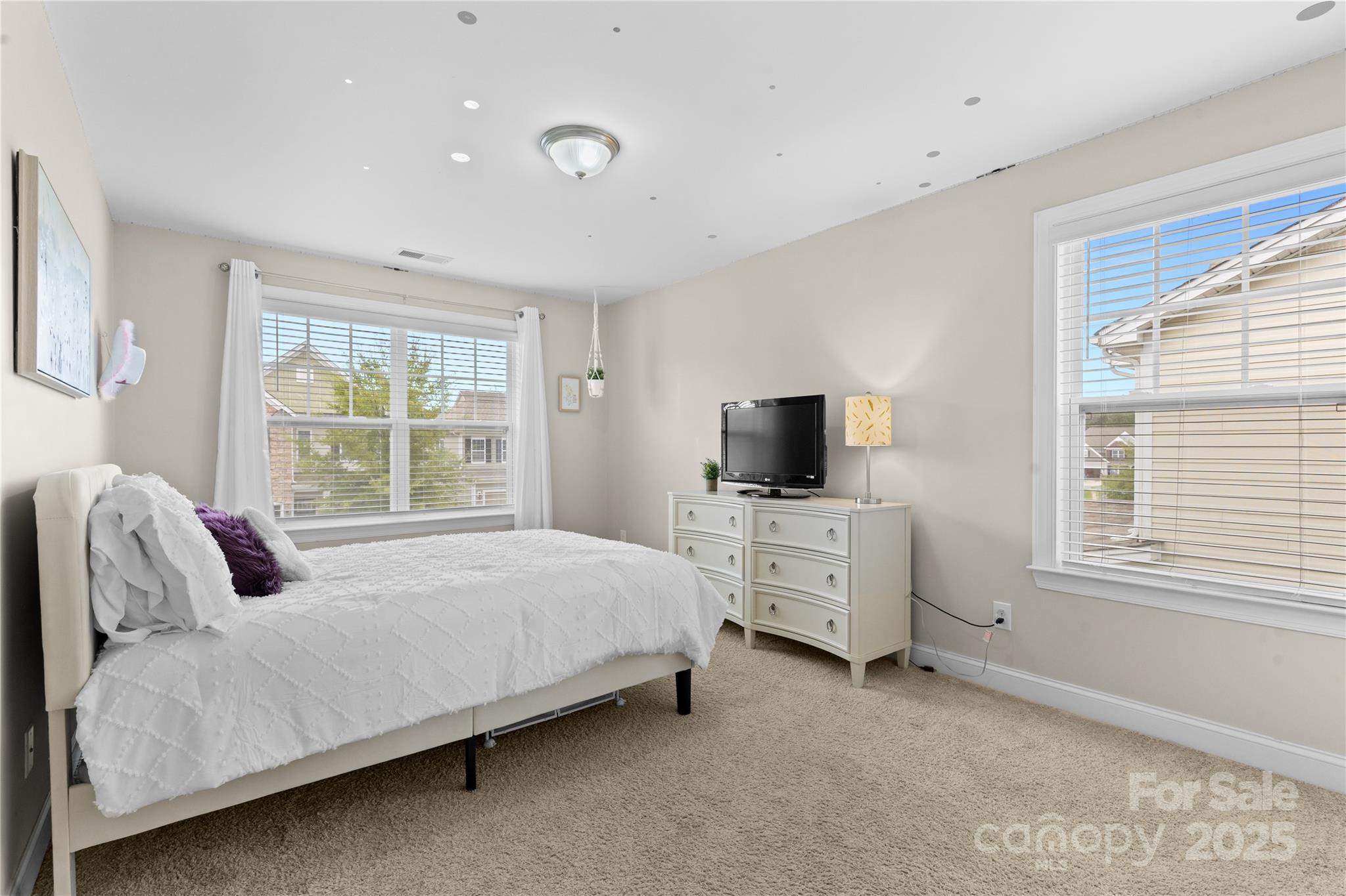 7035 Bareland Road Fort Mill, SC 29707 - Photo 32 of 47 a bedroom with bed and flat screen tv