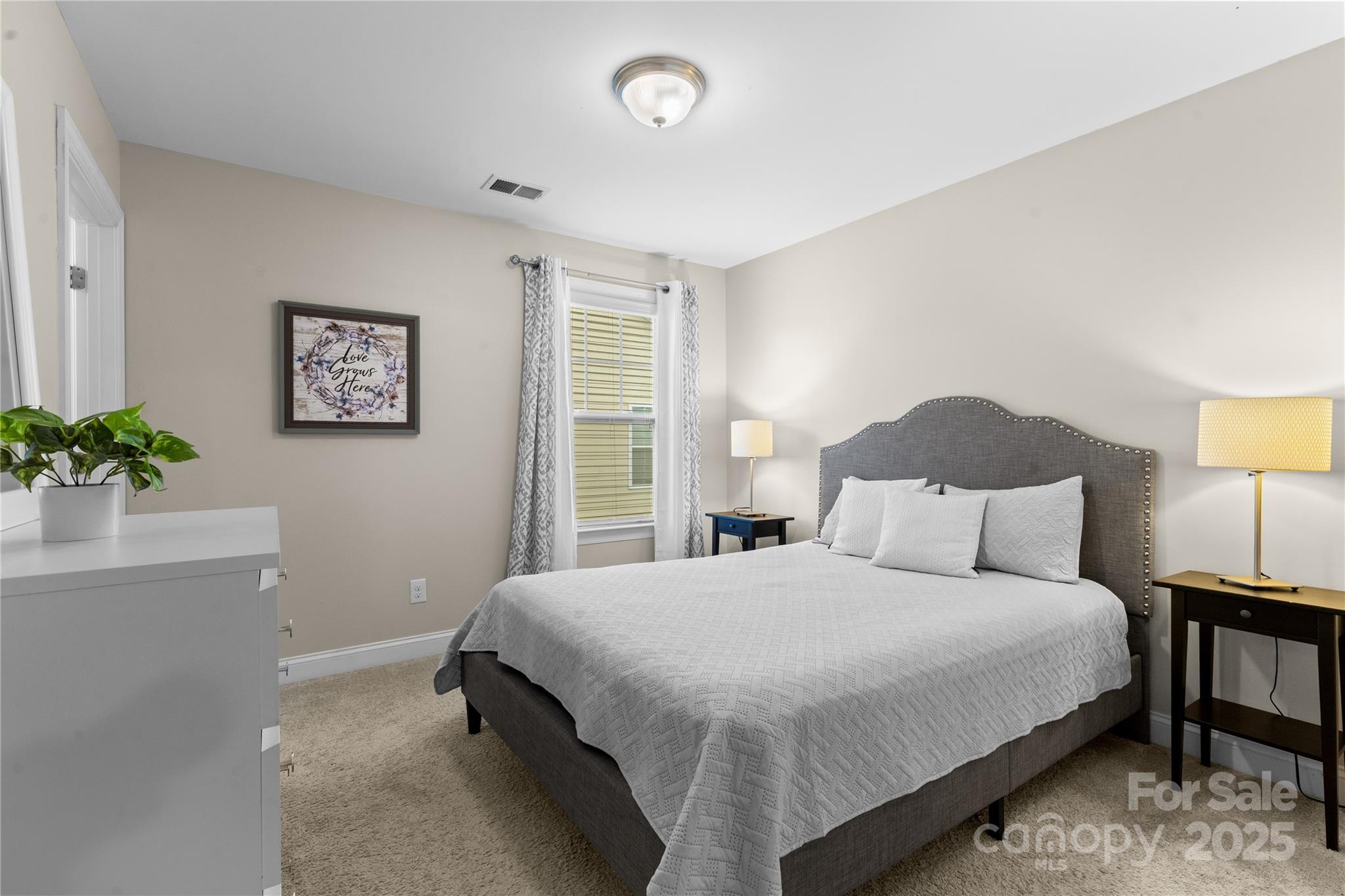 7035 Bareland Road Fort Mill, SC 29707 - Photo 34 of 47 a bedroom with a bed and a potted plant