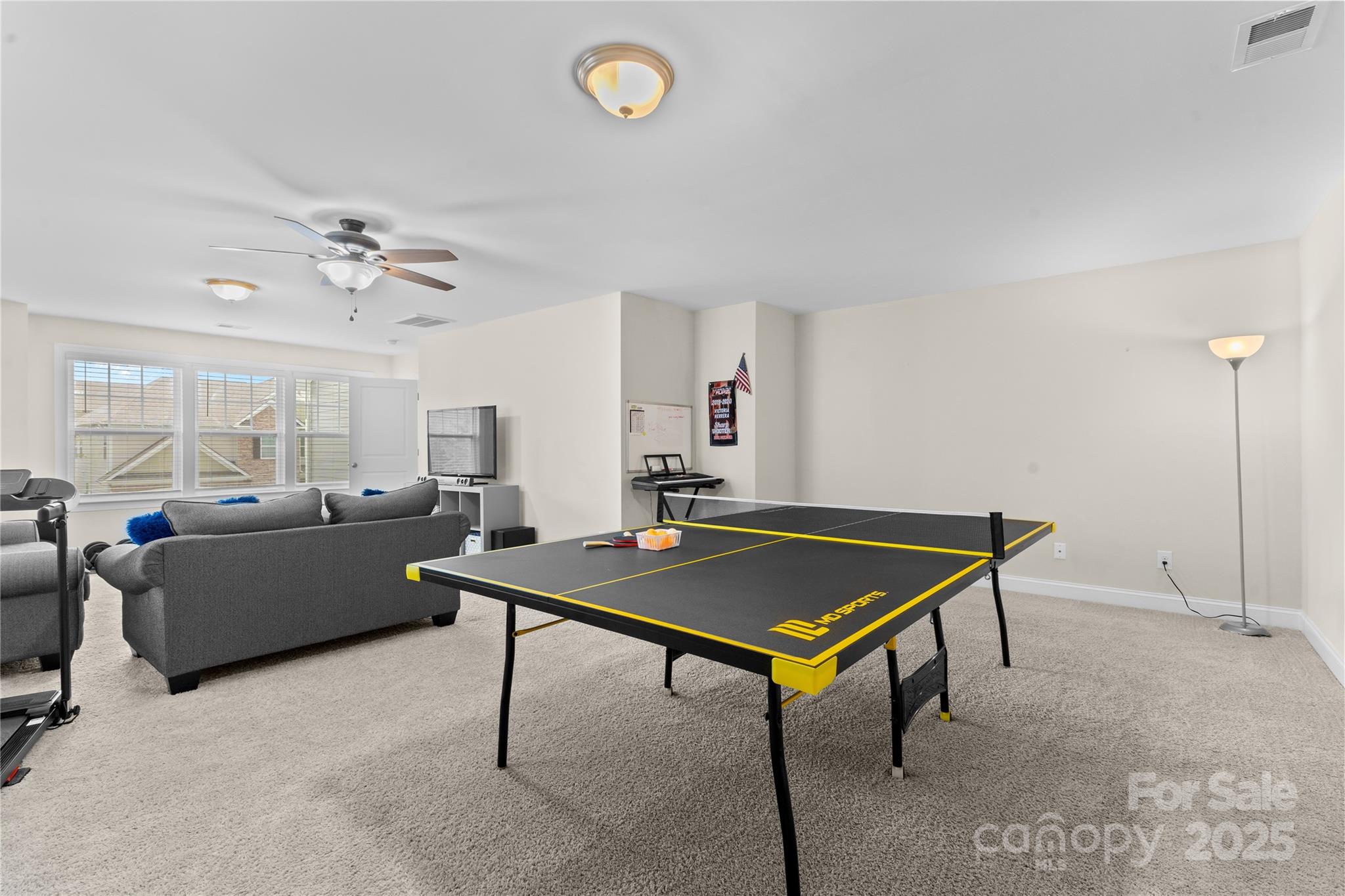 7035 Bareland Road Fort Mill, SC 29707 - Photo 38 of 47 a living room with furniture pool table and a window