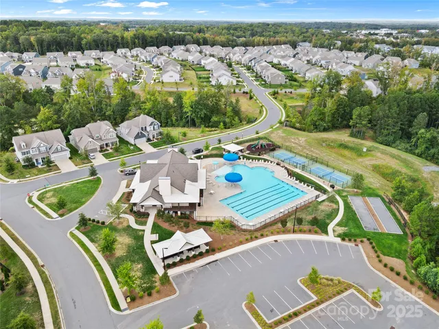 an aerial view of a house with garden space and patio