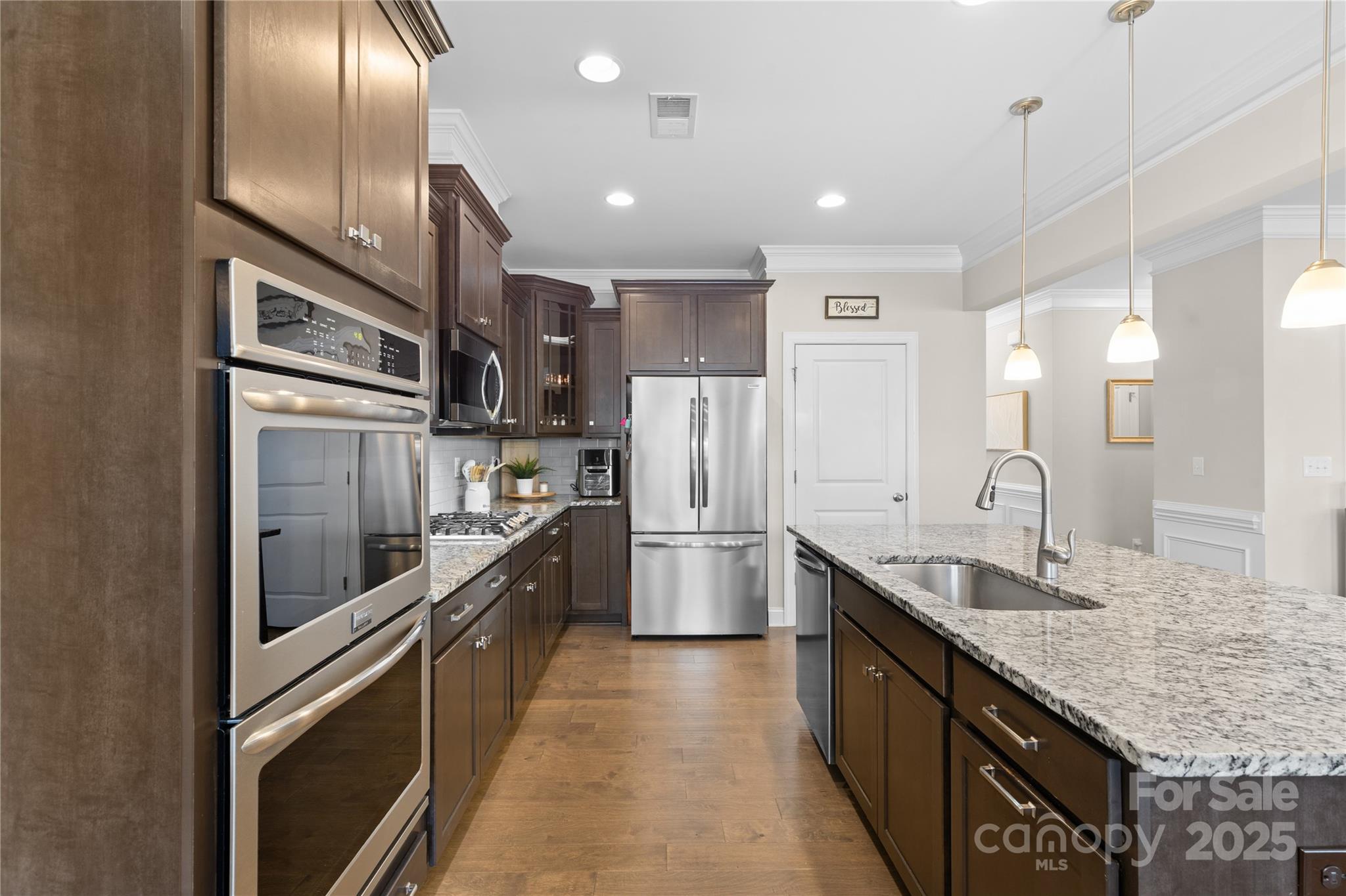 7035 Bareland Road Fort Mill, SC 29707 - Photo 10 of 47 a large kitchen with granite countertop lots of counter space and stainless steel appliances