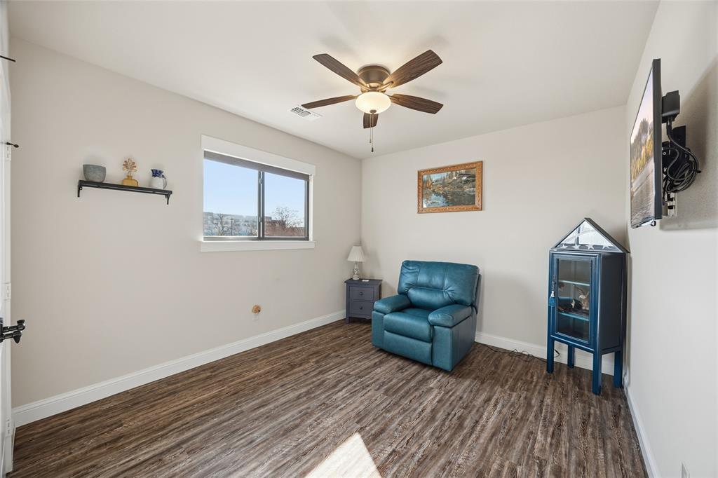 3105 Pastor Street Dallas, TX 75212 - Photo 22 of 28 Unfurnished bedroom with Luxury Vinyl wood like floors and a ceiling fan