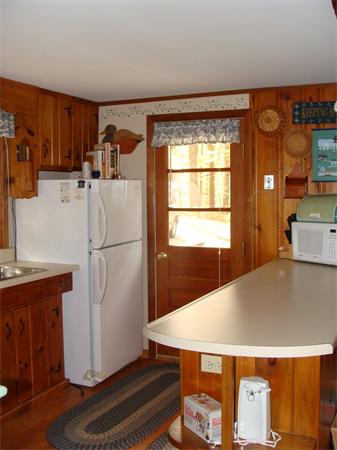 197 South Chesterfield Road Goshen, MA 01096 - Photo 13 of 29 a kitchen with stainless steel appliances a refrigerator and a stove