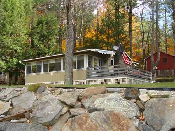 197 South Chesterfield Road Goshen, MA 01096 - Photo 19 of 29 a view of house with swimming pool and trees in the background