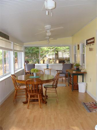 197 South Chesterfield Road Goshen, MA 01096 - Photo 8 of 29 a dining room with furniture a chandelier and a rug