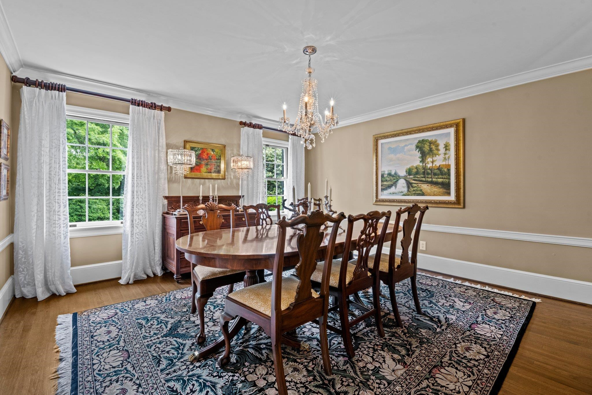 2217 St Marys Street Raleigh, NC 27608 - Photo 19 of 52 Separate formal Dining Room with smooth ceiling, crown molding, and two tall front windows. Dining Room