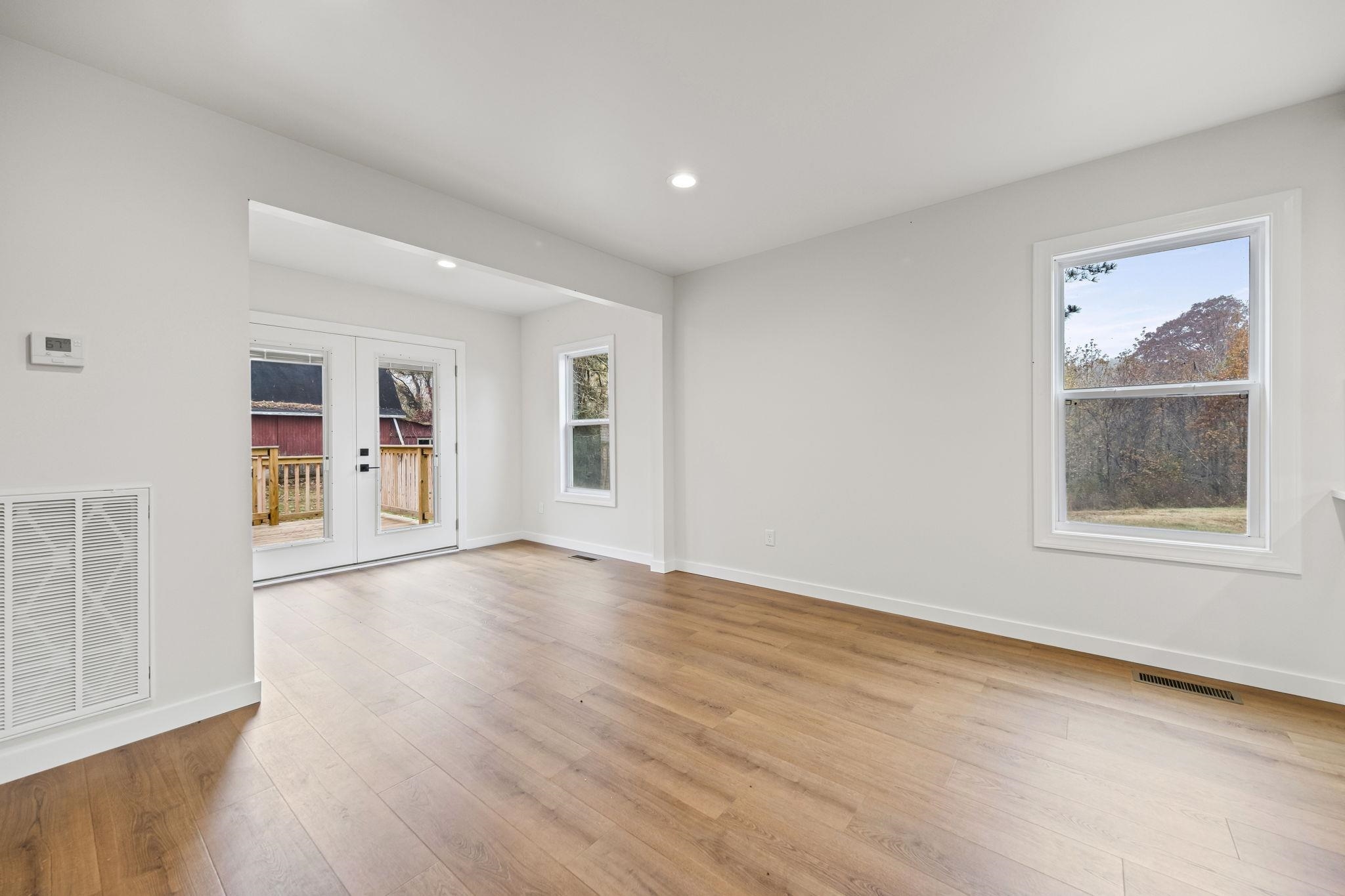 835 Curve Woodville Road Gates, TN 38037 - Photo 11 of 30 Dining room featuring light wood-style flooring, healthy amount of natural light, french doors, and recessed lighting