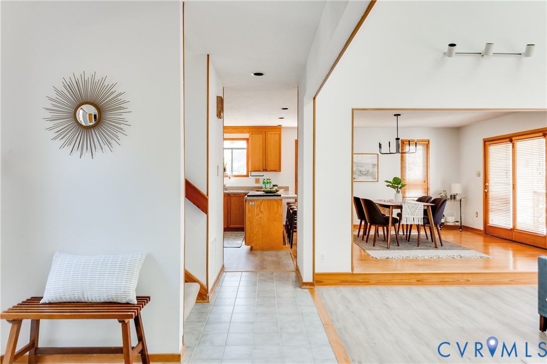 14722 Swift Water Road Chesterfield, VA 23838 - Photo 11 of 50 a view of a dining room with furniture and a chandelier