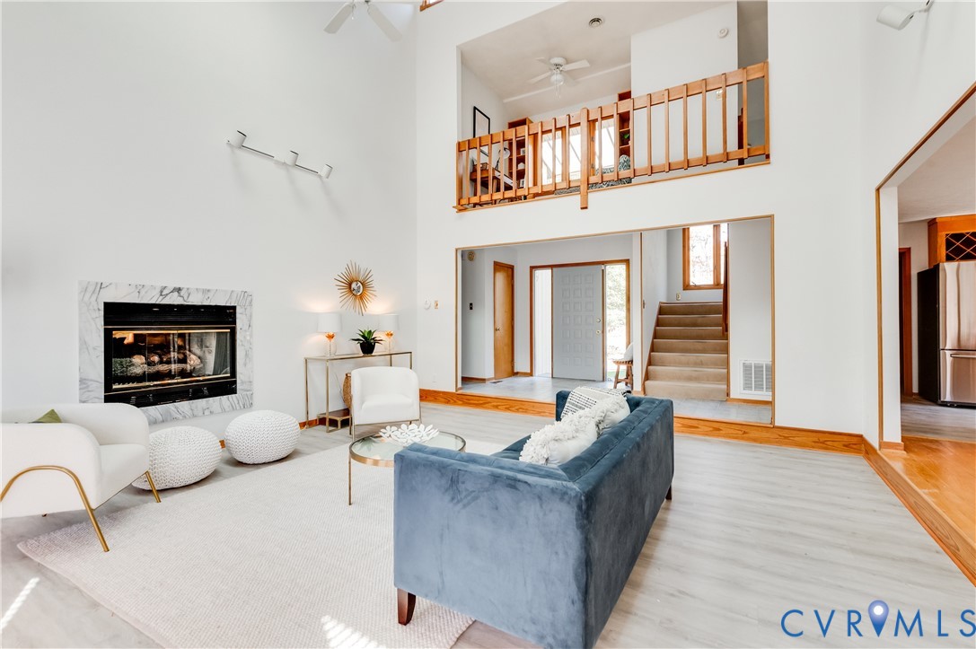 14722 Swift Water Road Chesterfield, VA 23838 - Photo 16 of 50 a living room with furniture and a fireplace