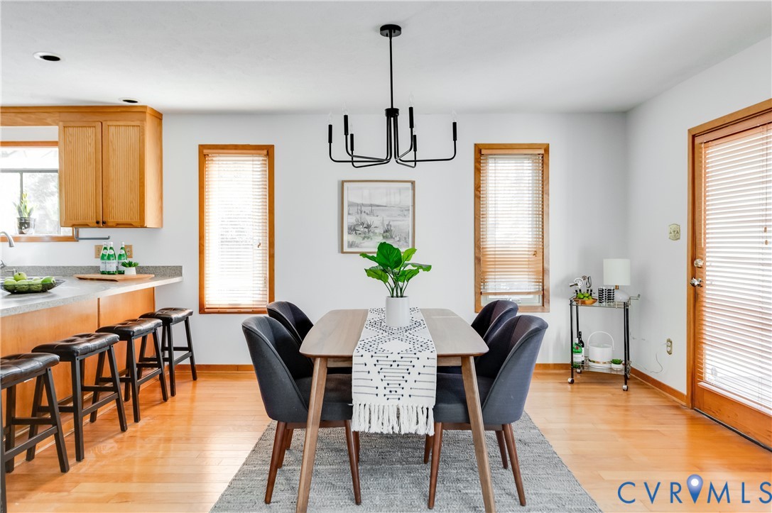 14722 Swift Water Road Chesterfield, VA 23838 - Photo 20 of 50 a view of a dining room with furniture window and wooden floor