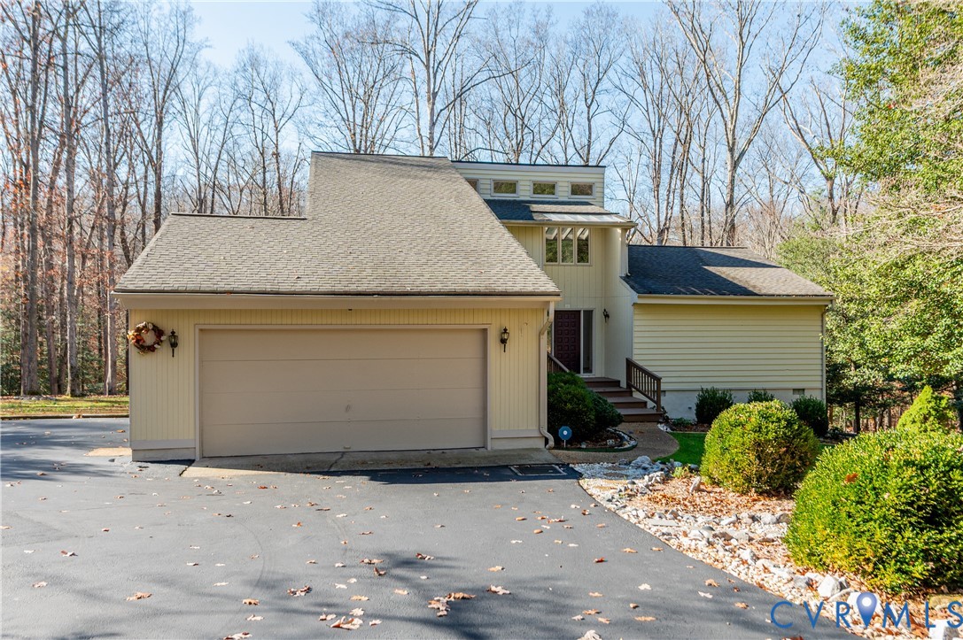 14722 Swift Water Road Chesterfield, VA 23838 - Photo 3 of 50 a front view of a house with garden