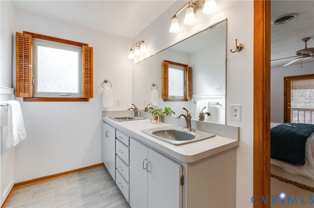 14722 Swift Water Road Chesterfield, VA 23838 - Photo 33 of 50 a bathroom with a sink and a mirror